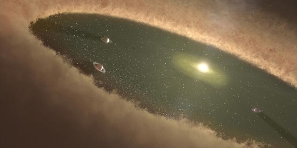 Ilustración artística de planetas en formación en un disco circunestelar como el que rodea a la estrella LkCa-15. Los planetas en el "gap" barren el material que, de otro modo, hubiese caído a la estrella. Créditos: NASA/JPL-Caltech